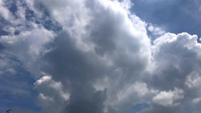 Time lapse of clouds in blue sky.