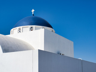 White monastery on blue sky background