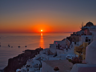 Sunset over sea and white town