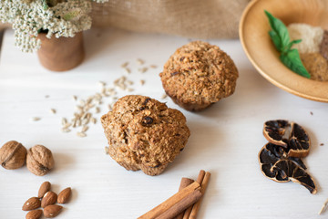 Whole wheat flour muffins. Sugar-free dessert, Healthy diet. Beautiful composition of flowers, ingredients and dessert