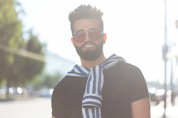 Portrait of a stylish young hipster arab male. Urban holiday at the weekend concept.