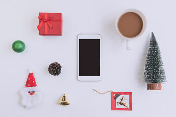 Empty screen smartphone with christmas ornament and copy space, Top view