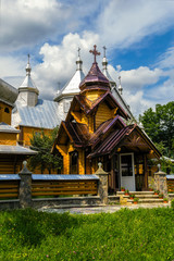 Verkhovyna, Ukraine. Beautiful wooden orthodox church on a background of summer cloudy sky.