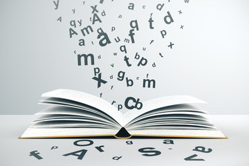 Open book and flying letters