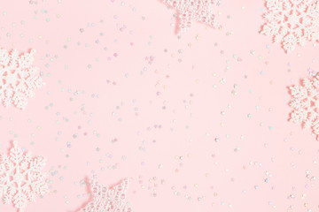 Christmas composition. White decorations on pastel pink background. Christmas, winter, new year concept. Flat lay, top view, copy space