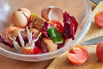 A bowl of food recycling waste on the kitchen. Closeup, selective focus