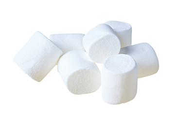 Lot of scattered pieces of raw sweet tasty marshmallows cylindrical form isolated on white background. Close-up