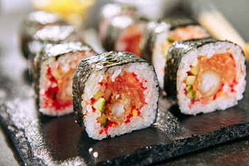 Hot Spicy Uramaki Sushi Rolls in Japanese Restaurant Closeup