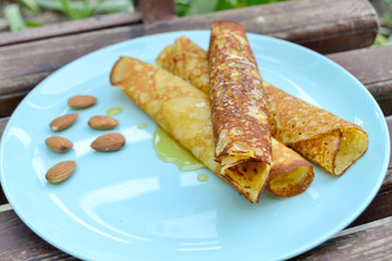 Juicy pancakes with honey and almonds