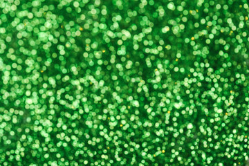 Green glitters. Green shiny abstract texture.