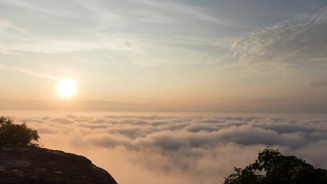 Time lapse of Morning mood and fog on mountain and sun with colorful clouds beatiful. Landscape sea fog and Sunrise Khao Phra Ya Dern Thong View Point. Phatthana Nikhom, Lopburi Thailand
