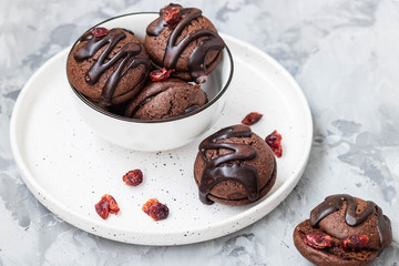 Chocolate chip cookies with chocolate smudges with cranberry jam