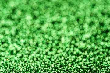Green shiny glitters background. Green abstract texture.