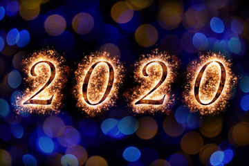 Happy New Year 2020 letters with sparkle and bokeh background