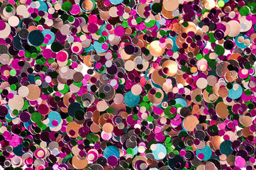 Shiny colour glitters. Abstract rounded glitters ful of colour.
