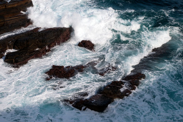 Kangaroo Island Australia, wave breaking over rocks at bottom of cliff