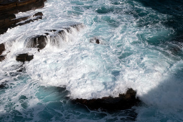 Fototapeta na wymiar Kangaroo Island Australia, wave breaking over rocks at bottom of cliff