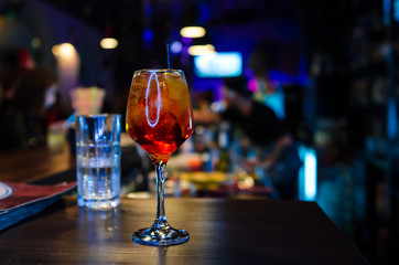 Glass of Aperol Spritz cocktail on the table in restaurant