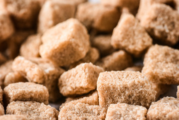 Brown sweet sugar cubes. Pile of sugar cubes.