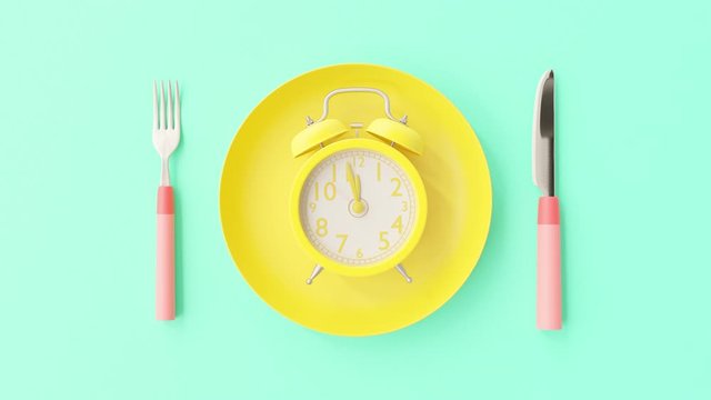 Yellow clock on yellow plate with fork and knife blue-green background, Break time idea concept. The beginning of time 11.45 run fast to 12.00. Timelapse moving fast, 3D Render.