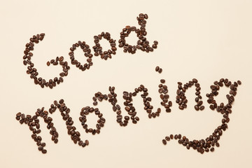 Good morning lettering made of coffee beans. Flat lay, top view
