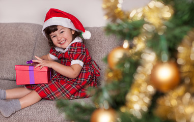 Cute child opens a christmas present