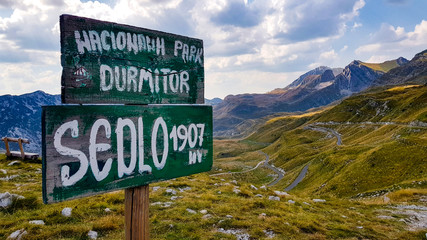 A view to Durmitor valley in Monte Negro under blue sky with clouds