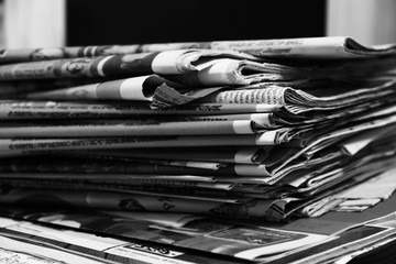 Stack of Newspapers. Magazines and Journals Stacked in Pile. Daily Papers with News. Folded Pages with Headlines and Articles. Business Press - obrazy, fototapety, plakaty