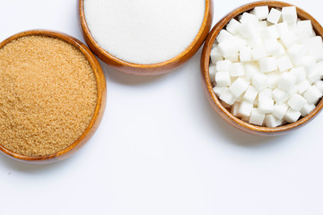 Various types of sugar on white background.