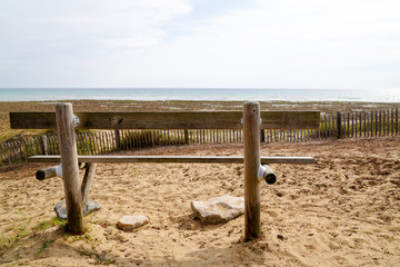 behind wooden bench in Atlantic coast in Jard sur Mer Vendée France