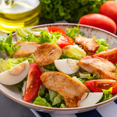 Salad with vegetables and chicken. Closeup