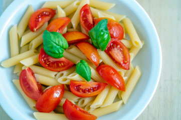 simple Italian pasta with olive oil, fresh tomatoes and basil.