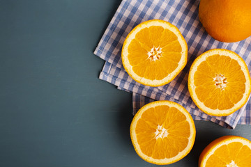 Half cut oranges on table with copy-space