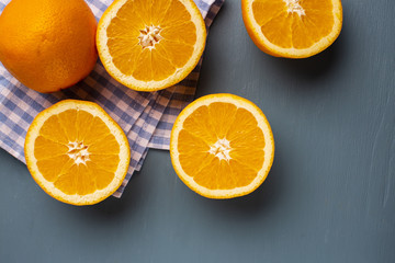 Top view half cut natural oranges on table
