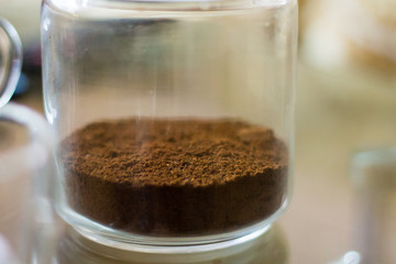 Dry coffee in a jar on the table. Not brewed coffee. Ground coffee in a jar. copy space