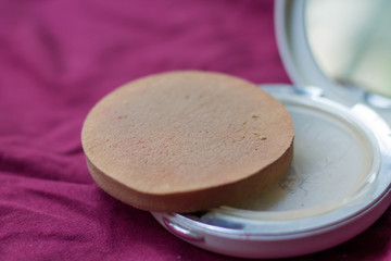 Obraz na płótnie Canvas Mirror with powder. Women's cosmetics. Powder box.