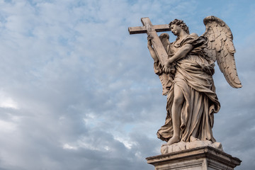 Bernini's marble statue of angel with cross from the Sant'Angelo Bridge in Rome, Italy.