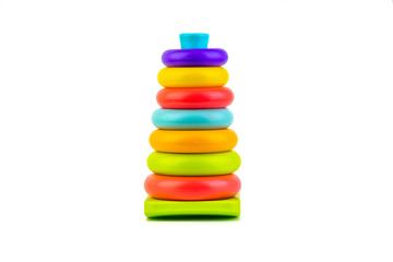 Plastic toy pyramid on a white background. Games and Copy space concept