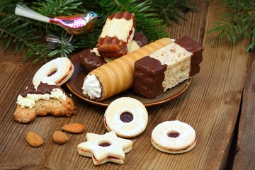 Christmas cookies made at home. Various xmas shortbread cookies on the brown wooden table. Typical for central Europe.