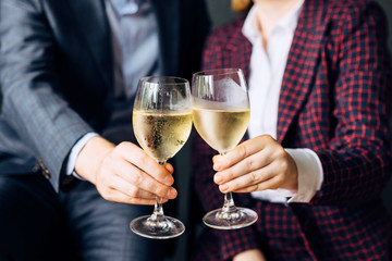 Hands with glasses of champagne