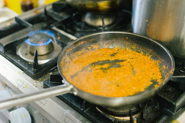close up gas stove with blue flames