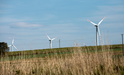 wind turbines farm, power generating windmills, Wind turbines on green hills