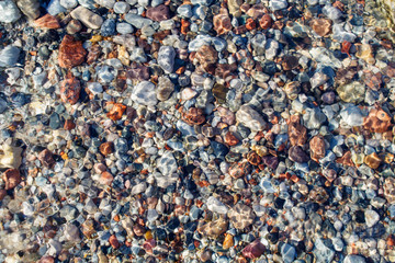 small multicolored stones under water