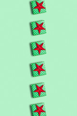 Christmas gift boxes pattern and red star, on green background. christmas shopping