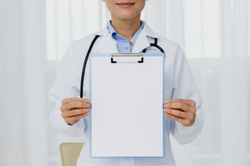 Doctor holding clipboard mock-up