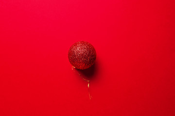  Christmas decoration, red balls on red background. Minimal New year concept