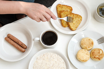 cheese pancakes, sausages, oatmeal, hash browns and coffee