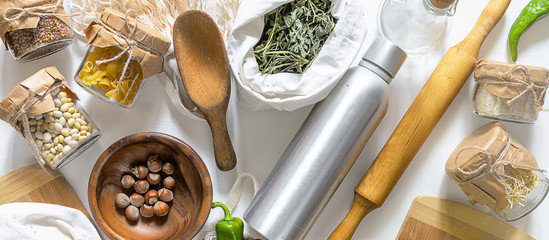 Vegetables and groceries in the kitchen. Storage in ecological friendly dishes, zero waste and no plastic concept, flat lay, top view