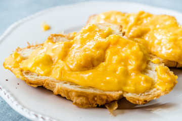 Scrambled Eggs with Croissant. Creamy Style.