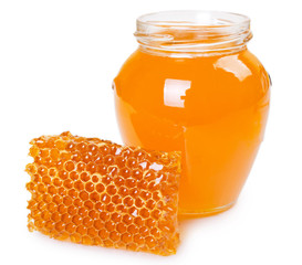 Honeycomb with honey on white background